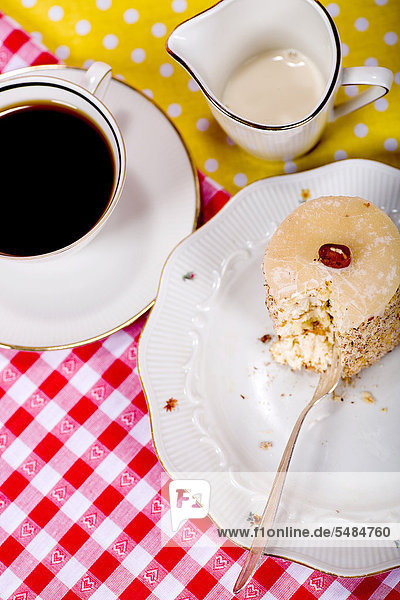 Piece of cake roll and a cup of coffee