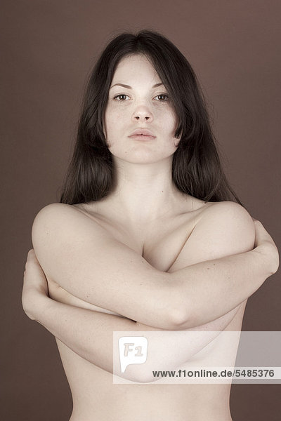Woman  naked upper body  embracing herself