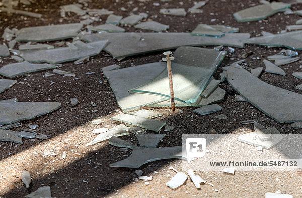 Broken glass  used syringe  destruction  abandoned factory
