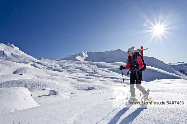 Snowshoe walker ascending to Forca Rossa Mountain through the Valfredda Valley above the Pellegrino Pass  Dolomites  Trentino  Italy  Europe