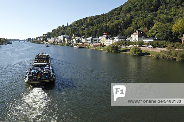 Boat transporting commercial waste on the Neckar River  Heidelberg  Baden-Wuerttemberg  Germany  Europe
