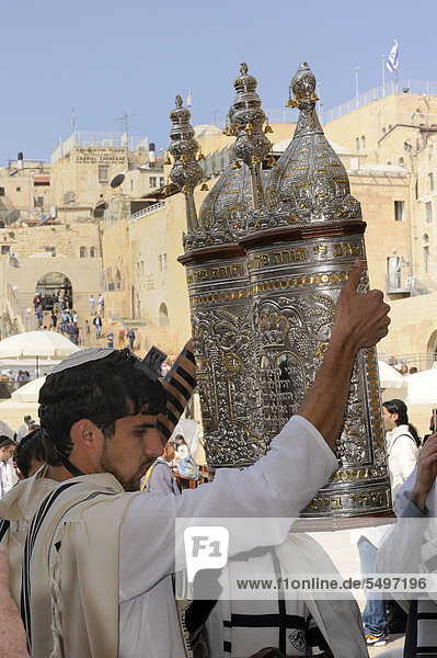 Torah being lifted in all cardinal directions during the Bar Mitzwa ceremony  Jewish quarter of the historic centre in the back  Arab quarter  Jerusalem  Israel  Middle East