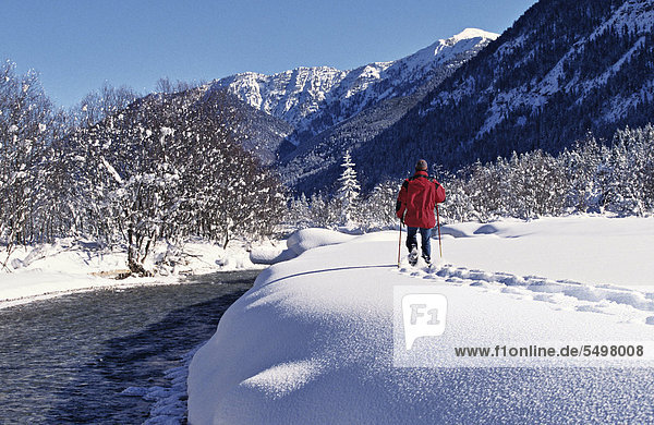 Man walking in pristine snow  Sylvenstein  Upper Bavaria  Germany  Europe