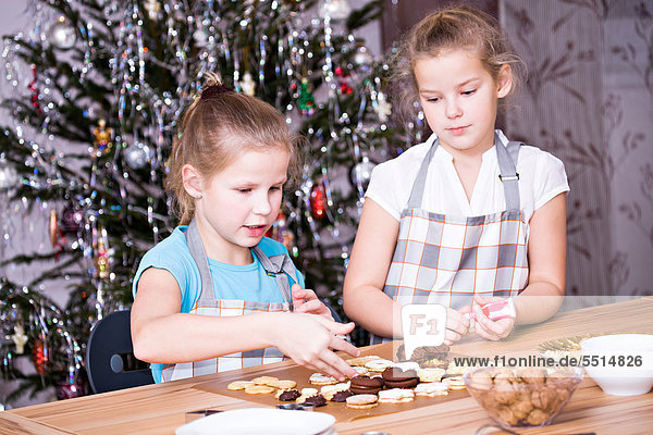 Girls baking Christmas cookies