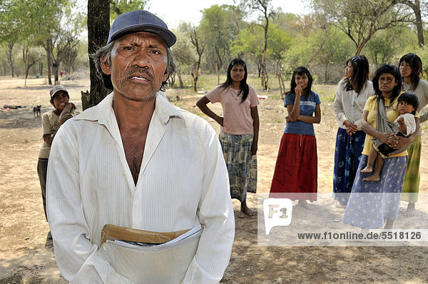Indigenous Cacique  community leader  from the Wichi Indians tribe holding documents that he will need for his community to lay claim on the land legally  if they fail to do so  the community will lose their habitat to major landowners through land grabbing  village of El Escrito  Gran Chaco  Salta  Argentina  South America