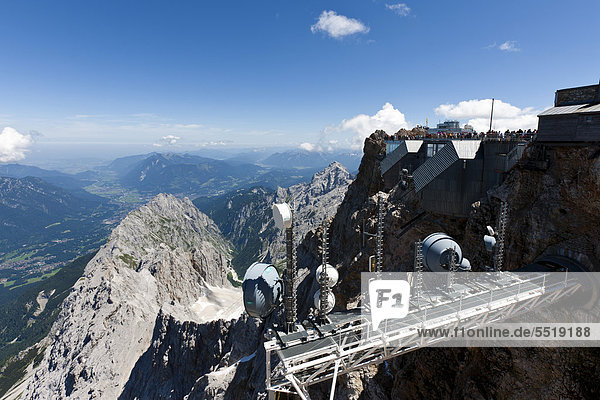 Distant view of the Garmisch-Partenkirchen valley  transmission tower of the meteorological station  summit house on Mt Zugspitze  Wetterstein range  Upper Bavaria  Bavaria  Germany  Europe