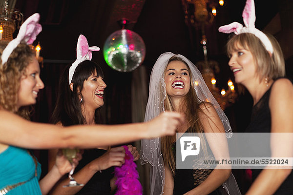 Women having bachelorette party in bar