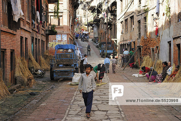 Boy on historic street  Bhaktapur  Kathmandu Valley  Nepal  Asia