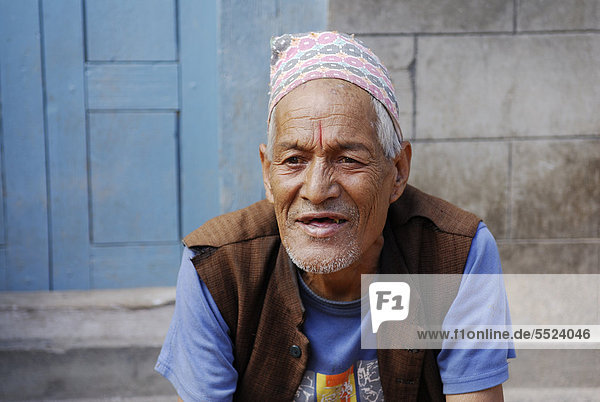 Man with traditional headwear  Bhaktapur  Kathmandu Valley  Nepal  Asia