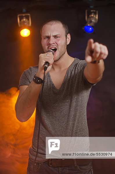 Singer with microphone in hand