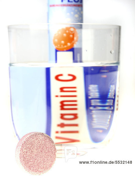 Vitamin C fizzy tablets and glass of water