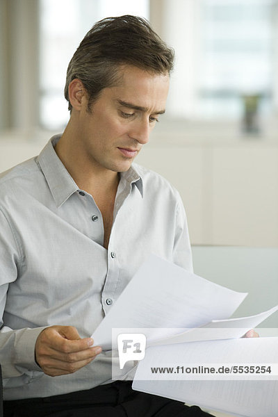 Businessman reading document