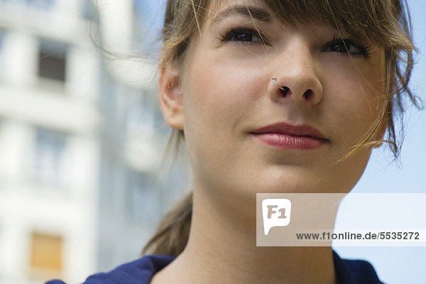 Young woman  looking away in thought  portrait