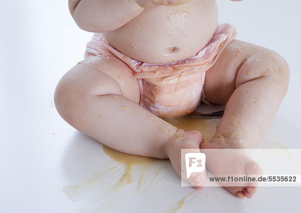 Infant covered in spilled food  low section