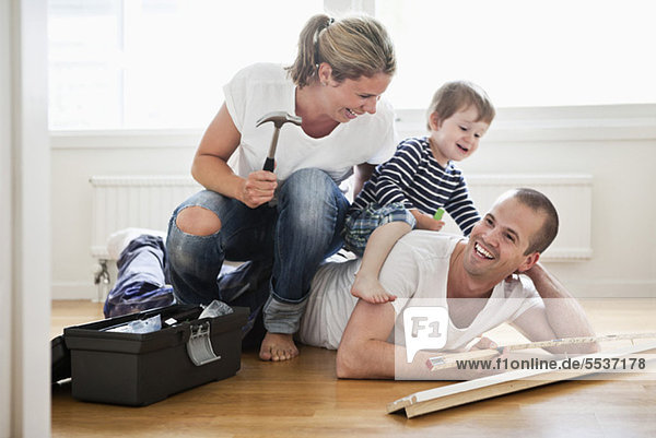 Family having fun while renovating their home