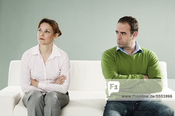 Mature couple on couch having an argument