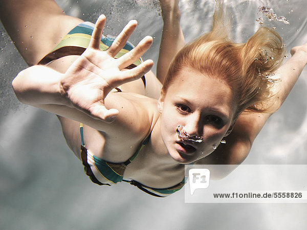 Swimming woman reaching out
