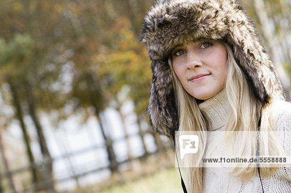 Woman wearing fur hat outdoors