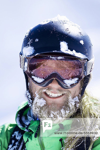 Close up of skiers snow-covered face