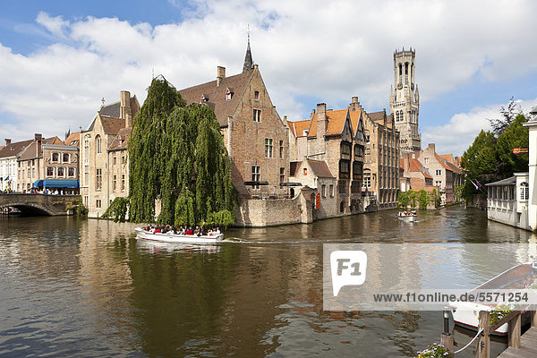 Excursion boat with tourists at the Historical Centre with guild houses on Rozenhoedkaai  Quay of the Rosary  historic city centre of Bruges  UNESCO World Heritage Site  West Flanders  Flemish Region  Belgium  Europe