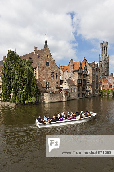 Excursion boat with tourists at the Historical Centre with guild houses on Rozenhoedkaai  Quay of the Rosary  historic city centre of Bruges  UNESCO World Heritage Site  West Flanders  Flemish Region  Belgium  Europe