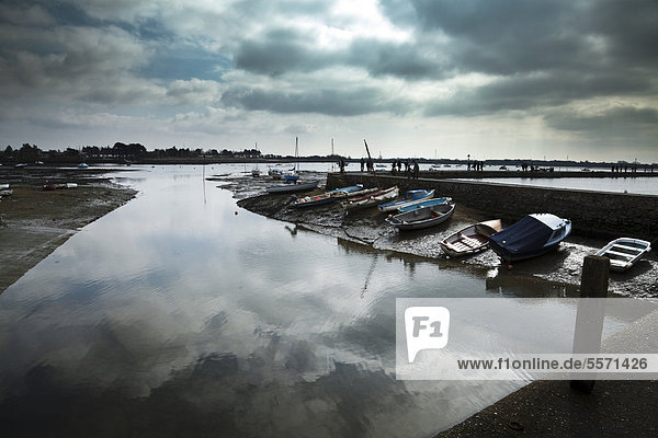 Dramatic sky and reflection in still water at low tide  Emsworth harbour  Chichester Harbour  England  United Kingdom  Europe