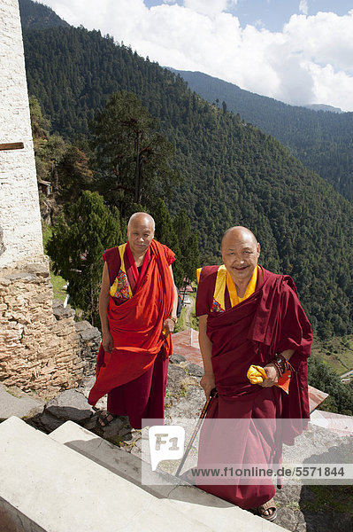 Two monks in red robes  Cheri Goemba Monastery  Chagri Dorjeden Monastery  near Thimphu  Kingdom of Bhutan  South Asia  Asia