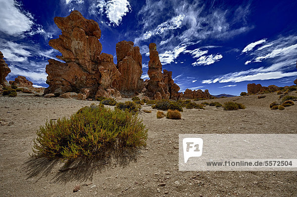 Rock formations against a blue cloudy sky  Uyuni  Bolivia  South America