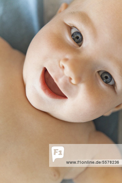 Baby smiling at camera  portrait
