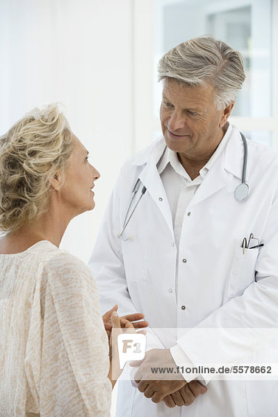 Doctor talking with patient