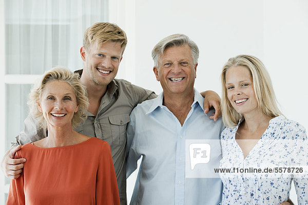 Mature parents with their adult son and daughter  portrait