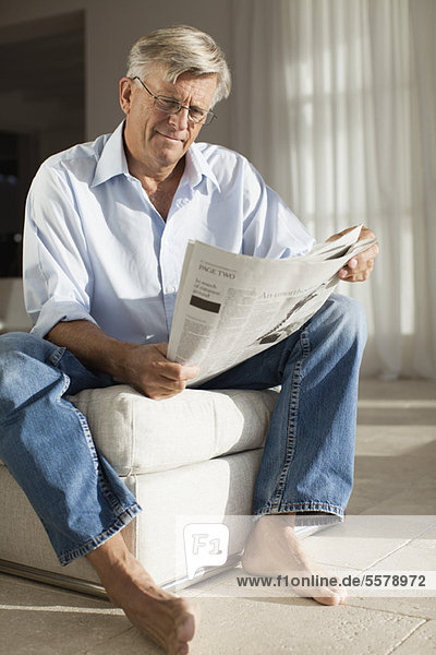 Senior man relaxing with newspaper