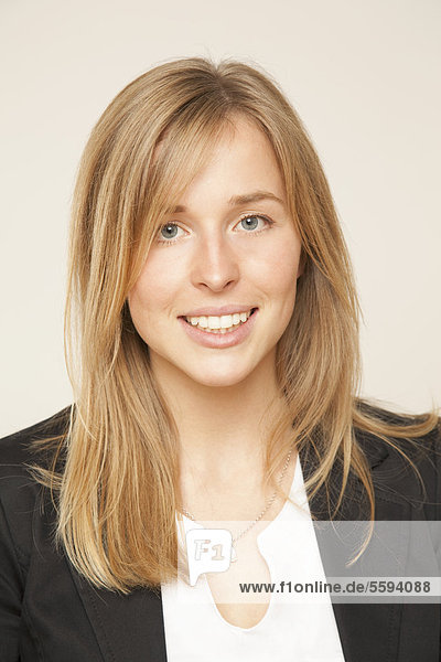 Young woman in bureau  smiling  portrait