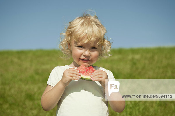 Girl eating watermelon  portrait
