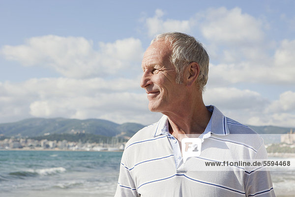 Spain  Mallorca  Senior man standing at sea shore