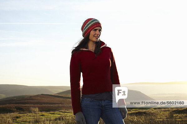 Woman standing in rural field
