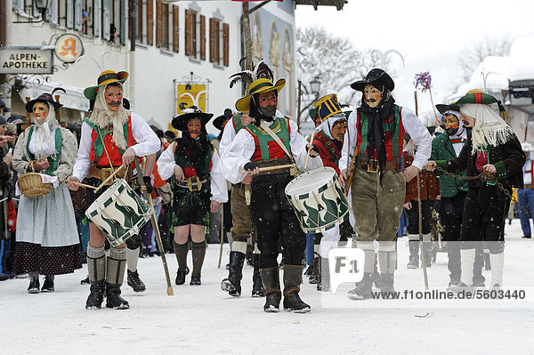Men dressed in traditional carnival costumes  carnival parade  Maschkera  Mittenwald  Werdenfelser Land  Upper Bavaria  Germany  Europe