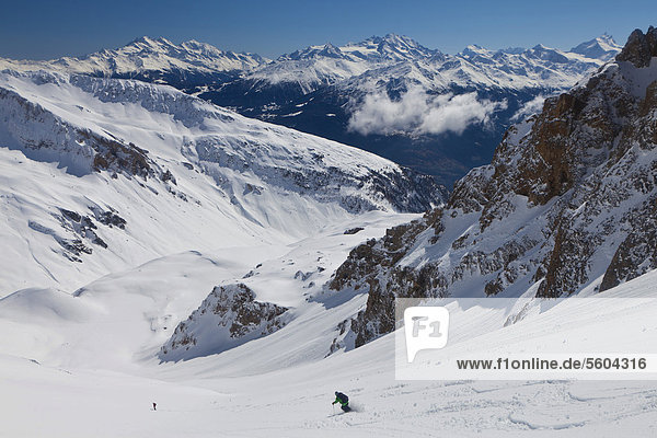Skiing downhill with mountain panoramic views  Mt Torrenthorn skiing tour  Leukerbad  Valais  Switzerland  Europe