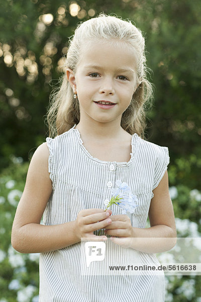 Girl holding flowers  portrait