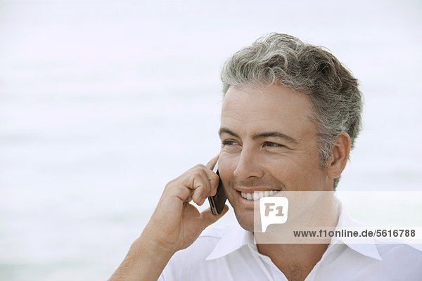 Man using cell phone outdoors  portrait
