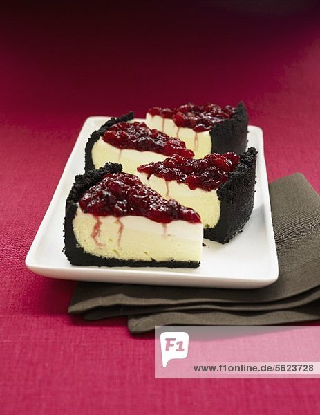 Cheese cake with sour cream  chocolate crust and cherry topping