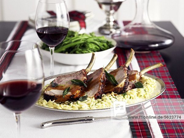 Pork cutlets on orzo  green beans and red wine