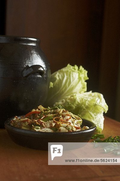 Kimchi in a bowl with fresh Chinese cabbage (Korea)