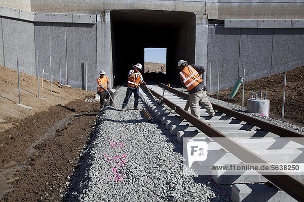 Workers build a light rail urban transit system linking Denver with its western suburbs  Lakewood  Colorado  USA