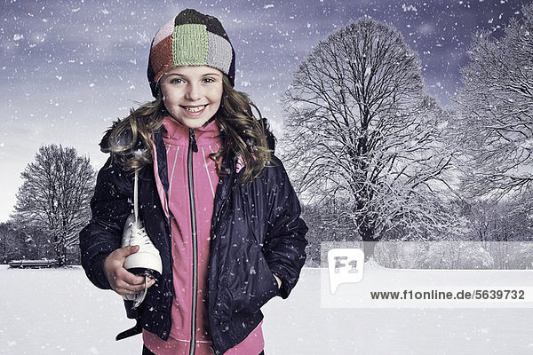 Girl carrying sneaker in snow