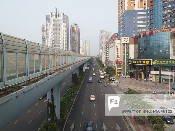 Multiple lane one way street and skyline Xiamen China