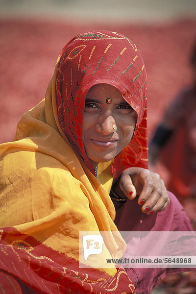 Young Indian woman wearing a red dupatta  near Shivpuri  Madhya Pradesh  India  Asia
