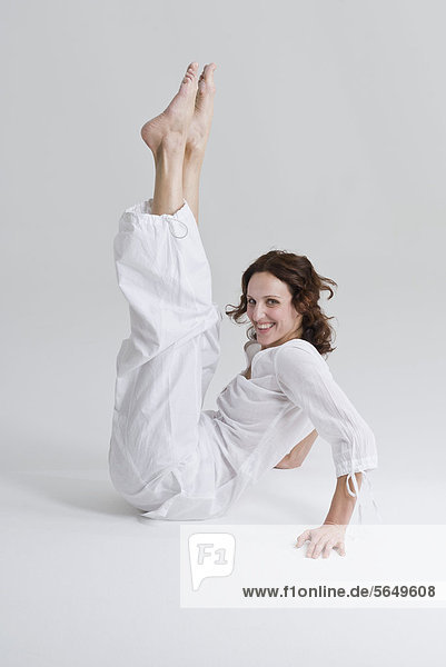 Mid adult woman doing exercise