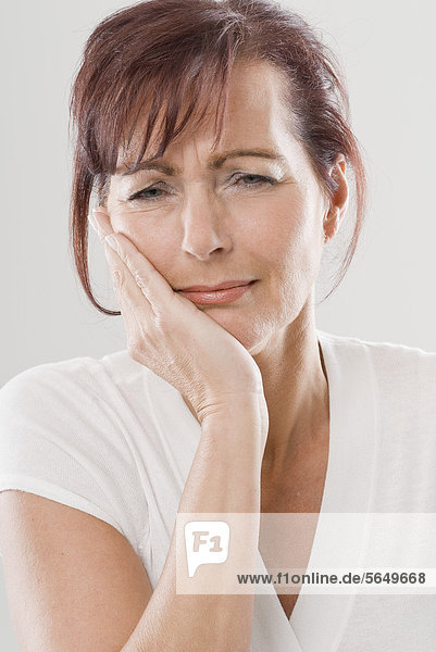 Mature woman with toothache  close up