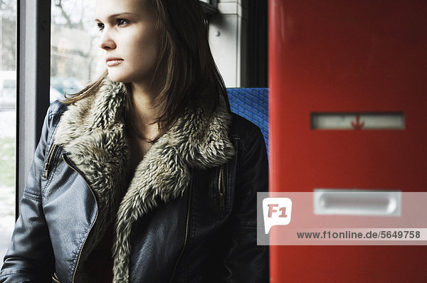 Young woman in public bus